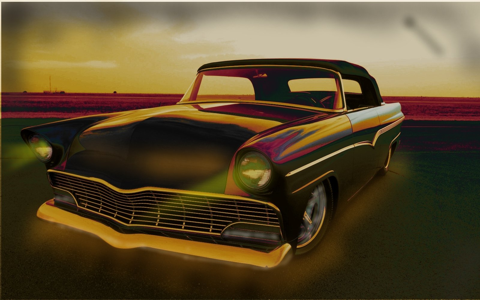 A sleek black vintage car with glowing headlights parked on a dark road at sunset, reflecting warm hues on its glossy surface.