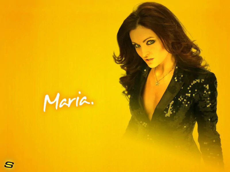 Maria Kanellis poses confidently against a vibrant yellow background, wearing a black sequined outfit, embodying her strong presence in the sports entertainment world.