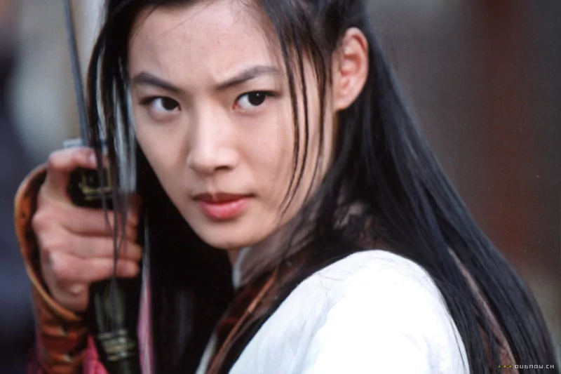A determined woman holds a sword, referencing the shadowless sword featured in a movie.