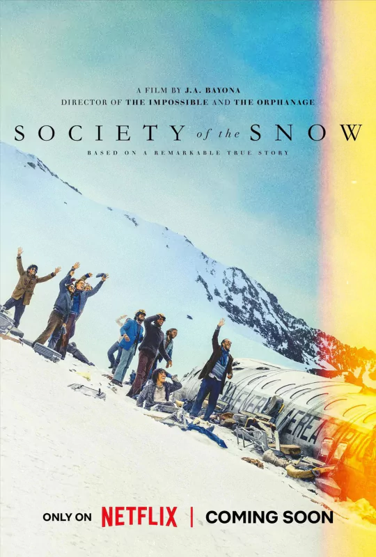 Promotional poster for the upcoming Netflix film 'Society of the Snow' directed by J.A. Bayona, showcasing a group of survivors in a snowy mountain landscape, indicating a story of survival and adventure.