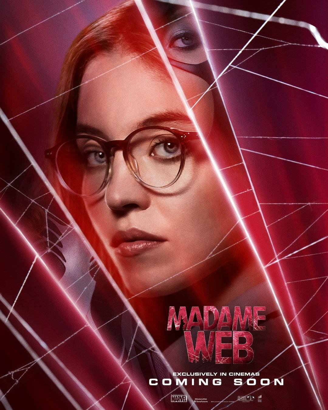 Promotional poster for the Madame Web movie featuring a close-up of the lead character with spider-web overlay, hinting at the film's connection to the spider-themed universe, with text stating Coming Soon.