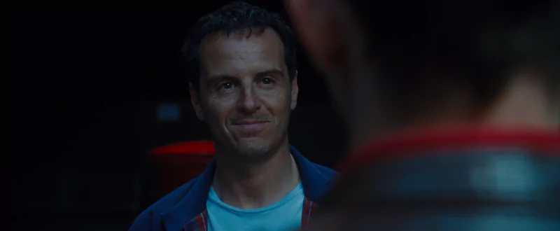 A man smiling in a scene from the movie All of Us Are Strangers.