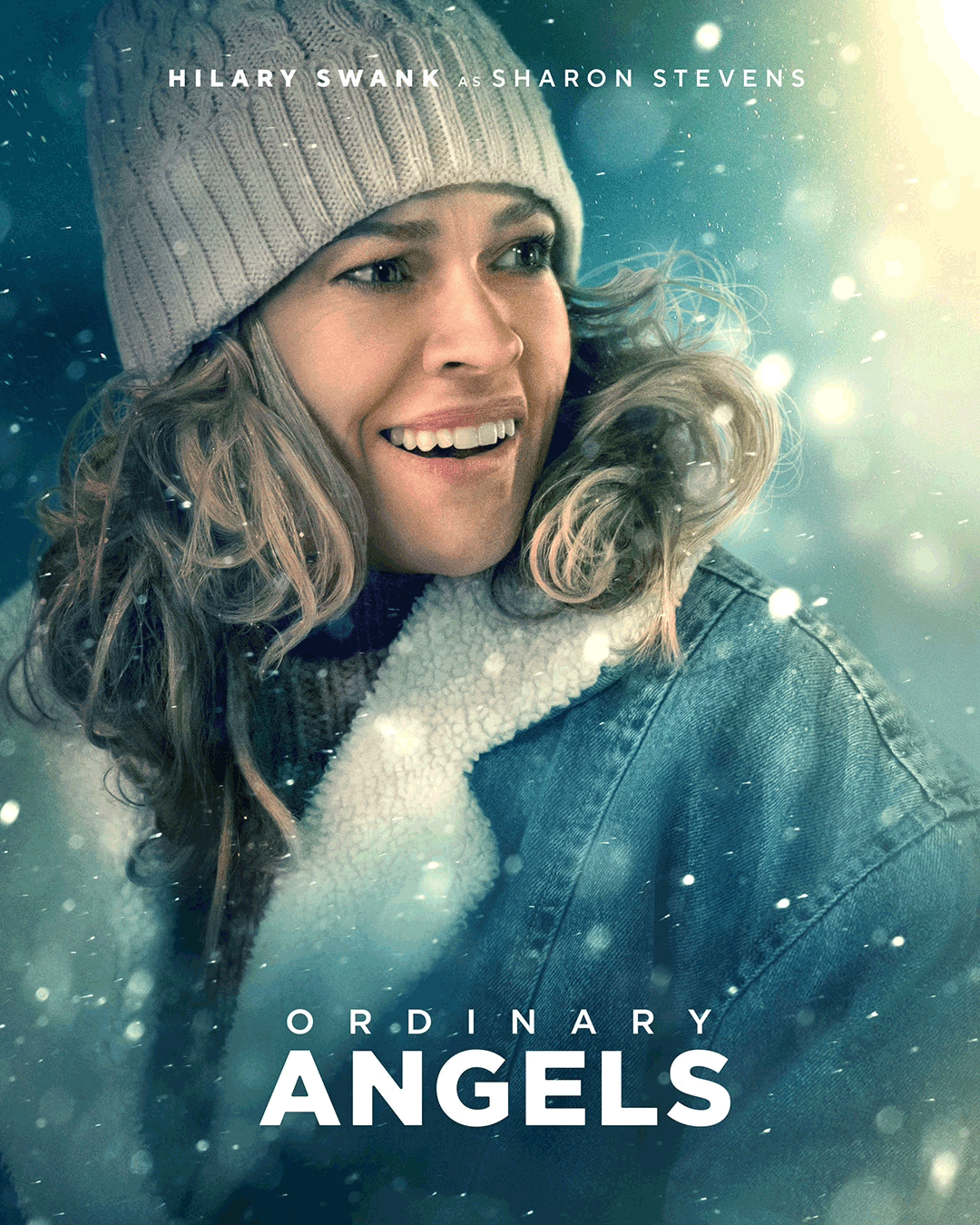 Promotional poster for the movie Ordinary Angels featuring a smiling woman in winter attire with snowfall around, starring Hilary Swank.