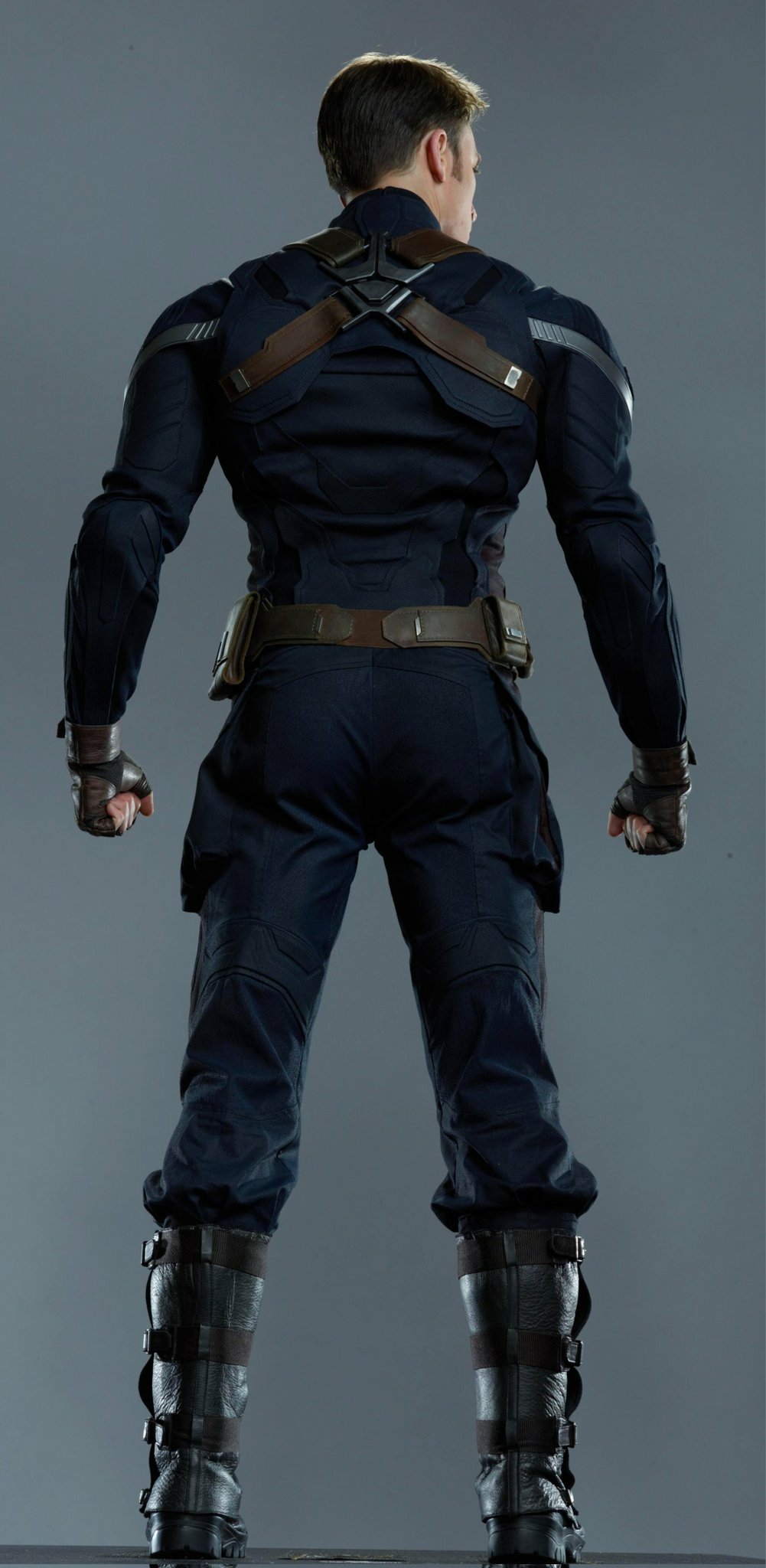 Captain America standing strong with his shield in hand under a stormy sky, a scene from Captain America: The Winter Soldier.