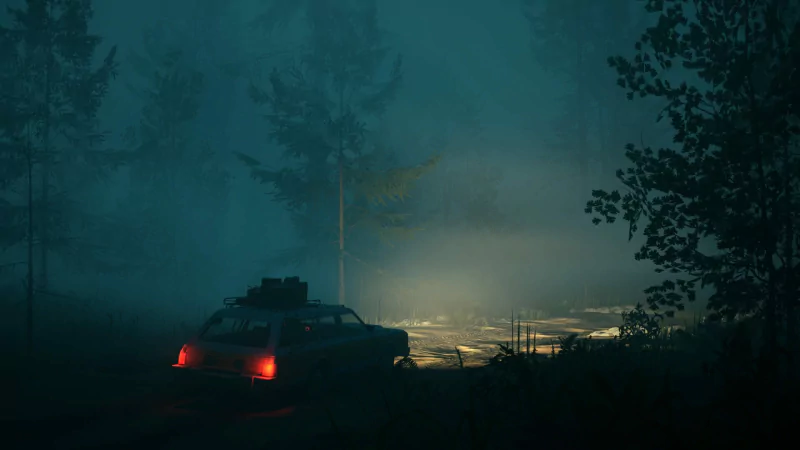 Shadowy scene from the video game Pacific Drive featuring a car with red tail lights on a foggy forest road at night.