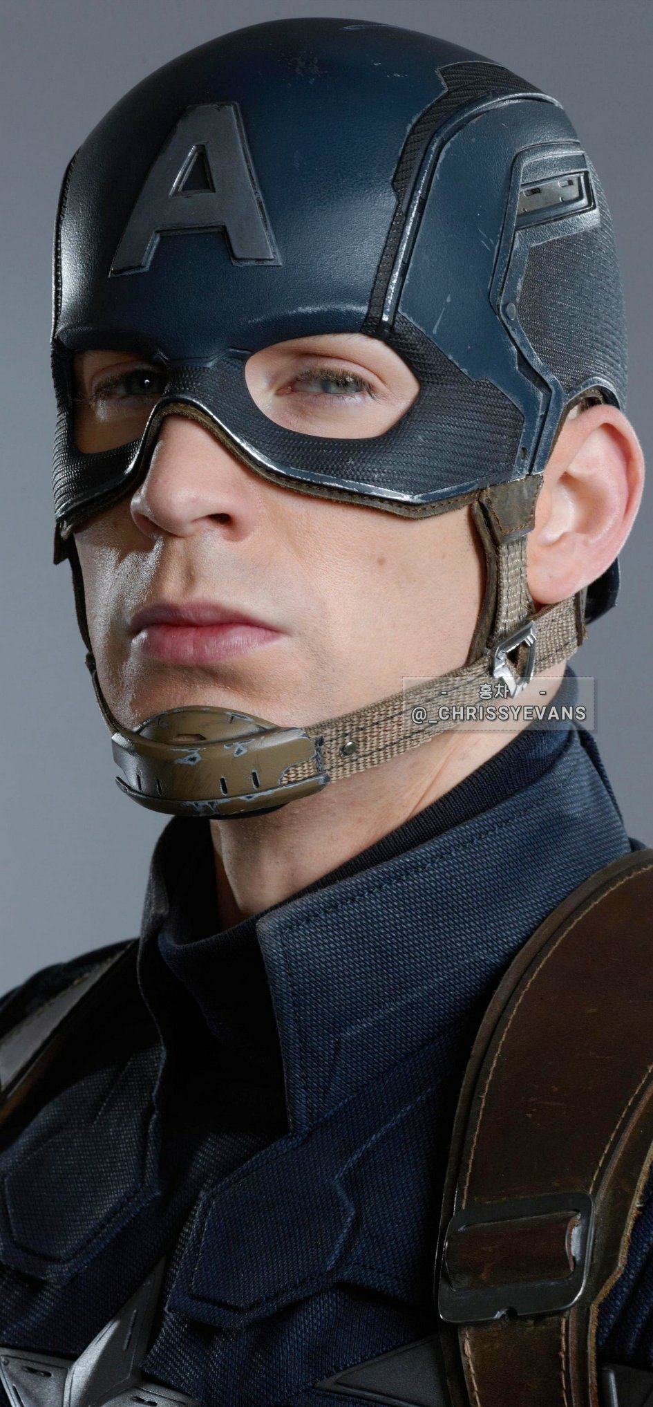 Captain America standing confidently in his iconic suit, shield in hand, in a dynamic pose from The Winter Soldier.