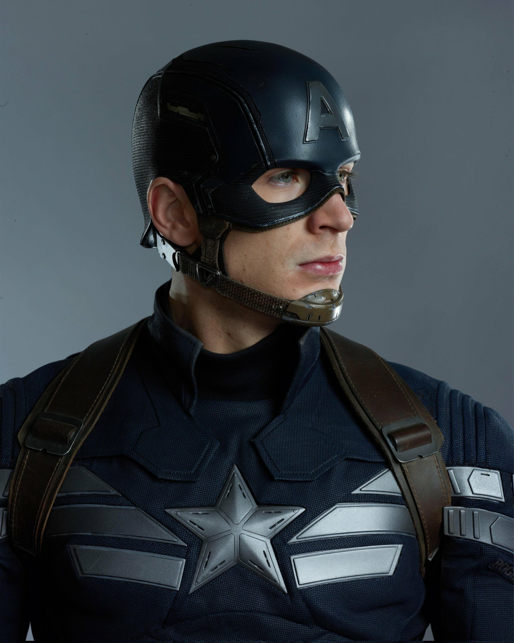 Captain America: The Winter Soldier - A superhero in patriotic attire holding a shield, ready for battle.
