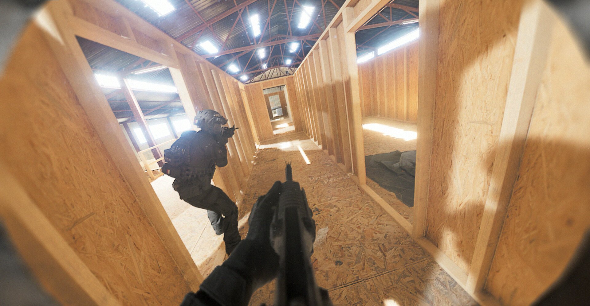 In-game bodycam view of a first-person shooter video game, showing armed characters navigating a wooden corridor in a tactical scenario.