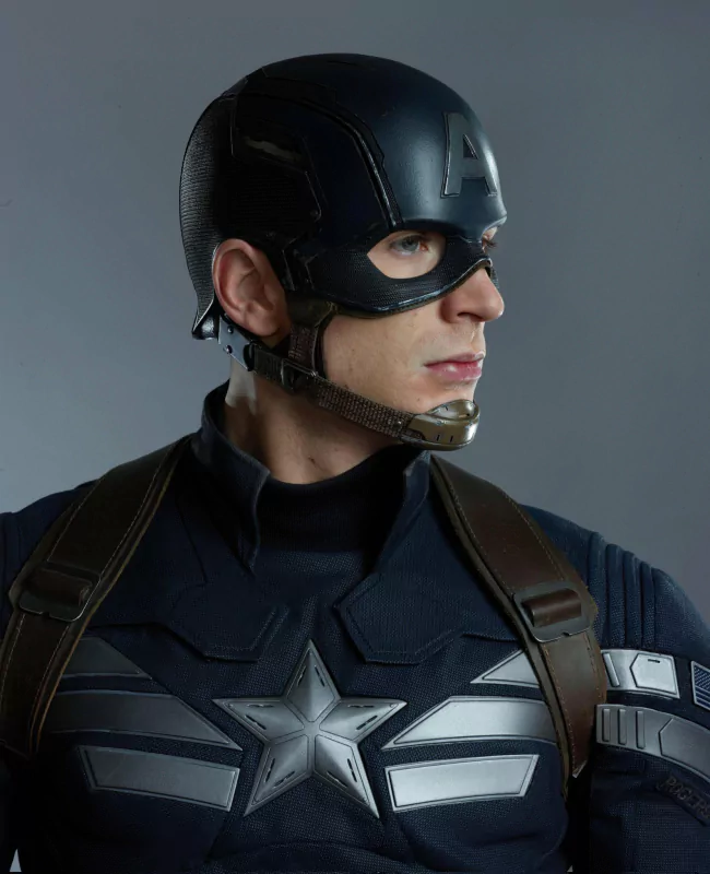 Chris Evans as Captain America in The Winter Soldier, standing confidently in his costume with a determined look.
