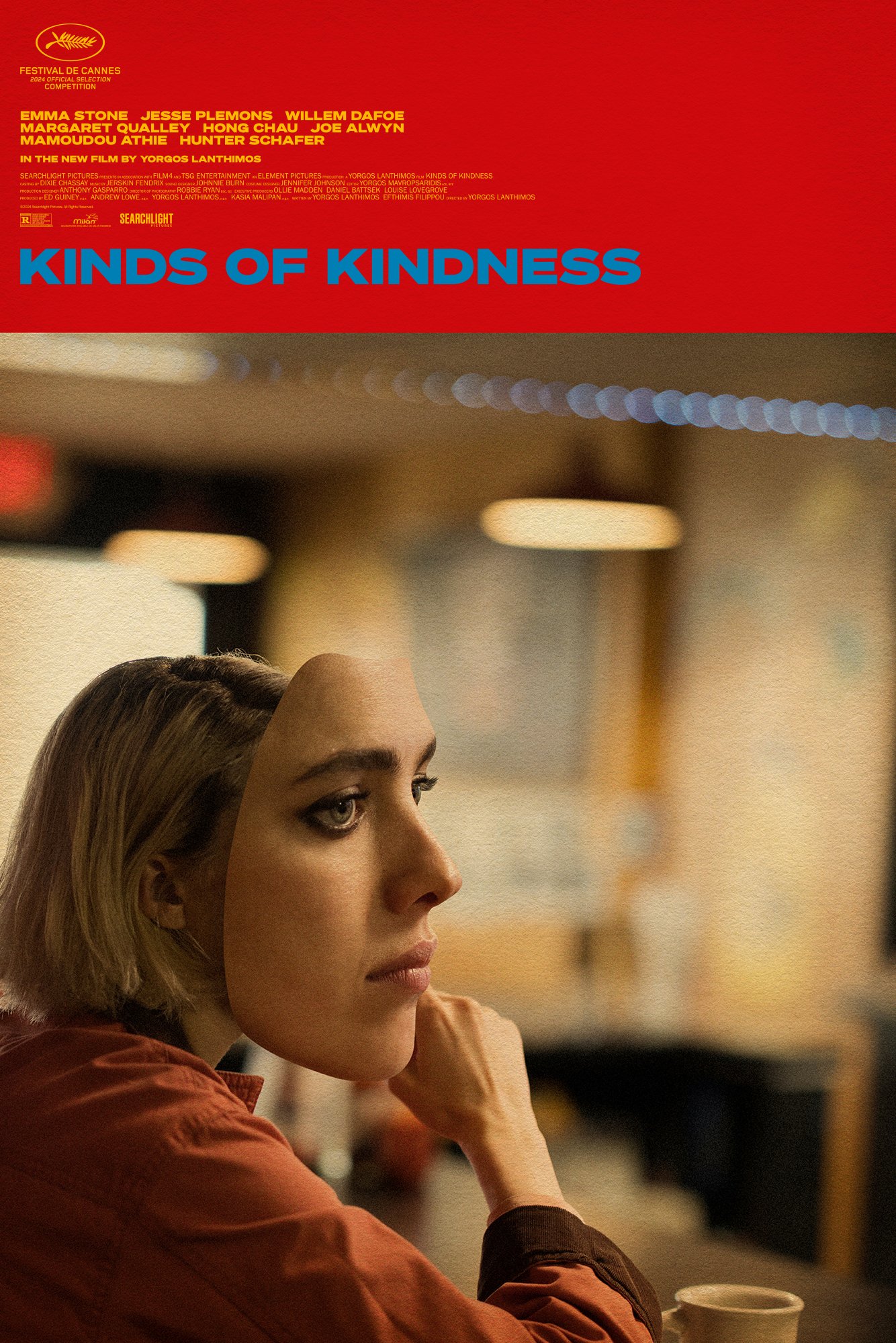 A movie poster for Kinds of Kindness featuring a thoughtful person gazing into the distance in a softly lit, blurred indoor setting.
