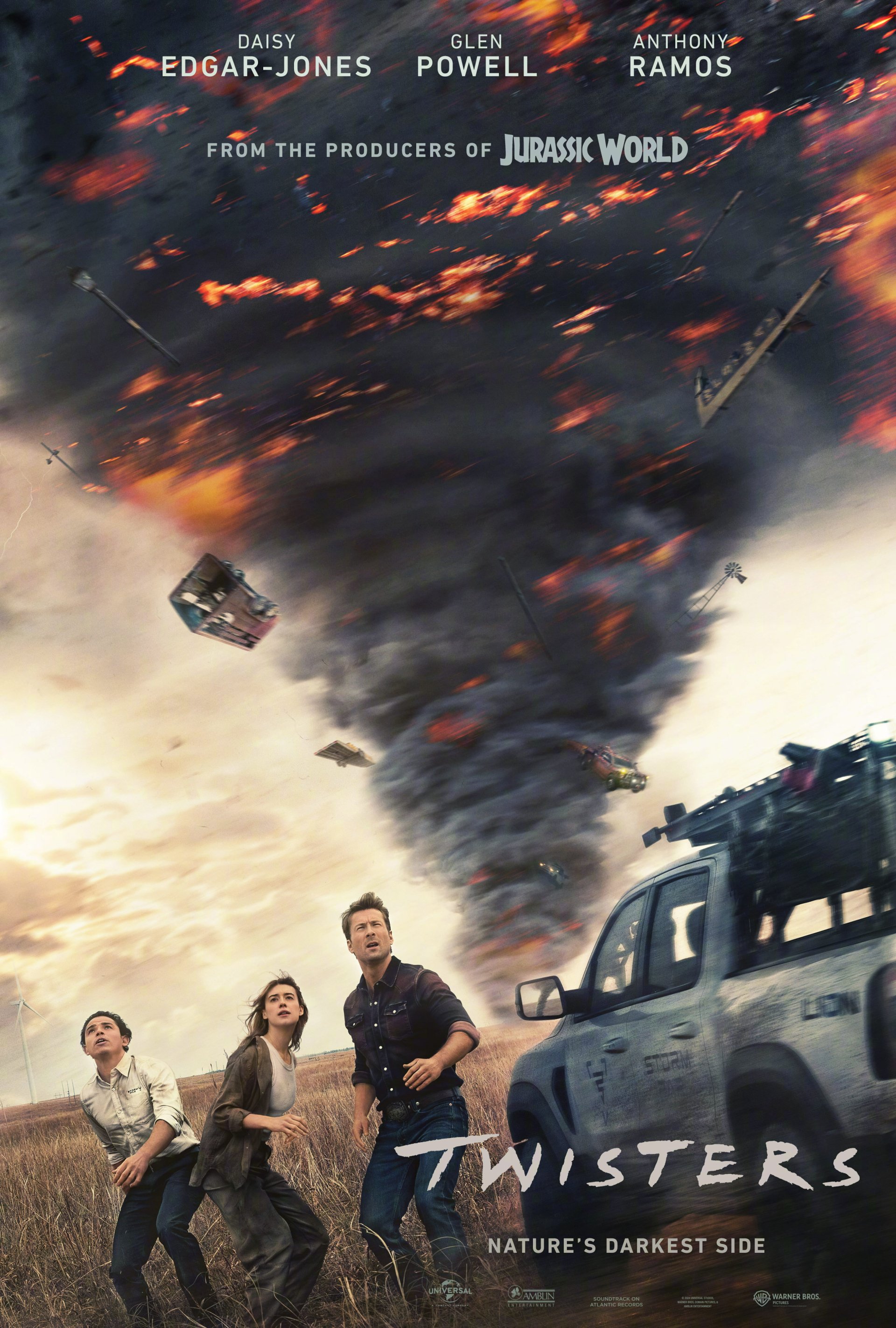 Movie poster for Twisters featuring three people running from a massive tornado, with debris flying in the air and a vehicle nearby. The text highlights actors Daisy Edgar-Jones, Glen Powell, and Anthony Ramos.