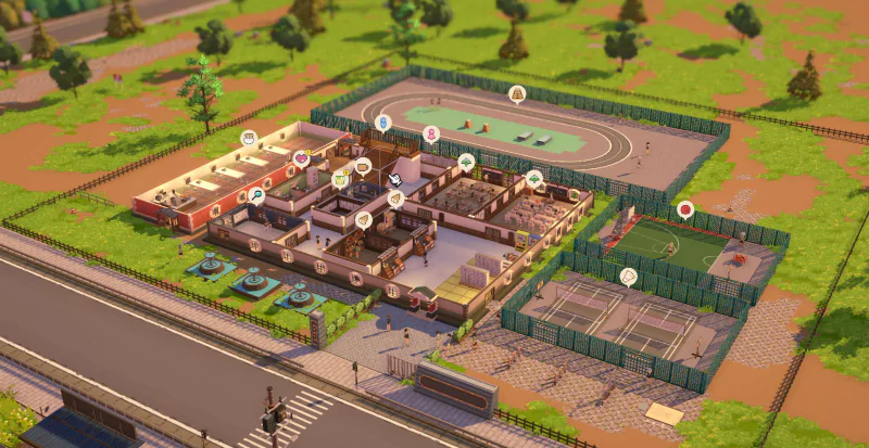 Aerial view of a school campus in the video game Let's School, featuring various buildings, a running track, tennis courts, and a surrounding fence among a green landscape.