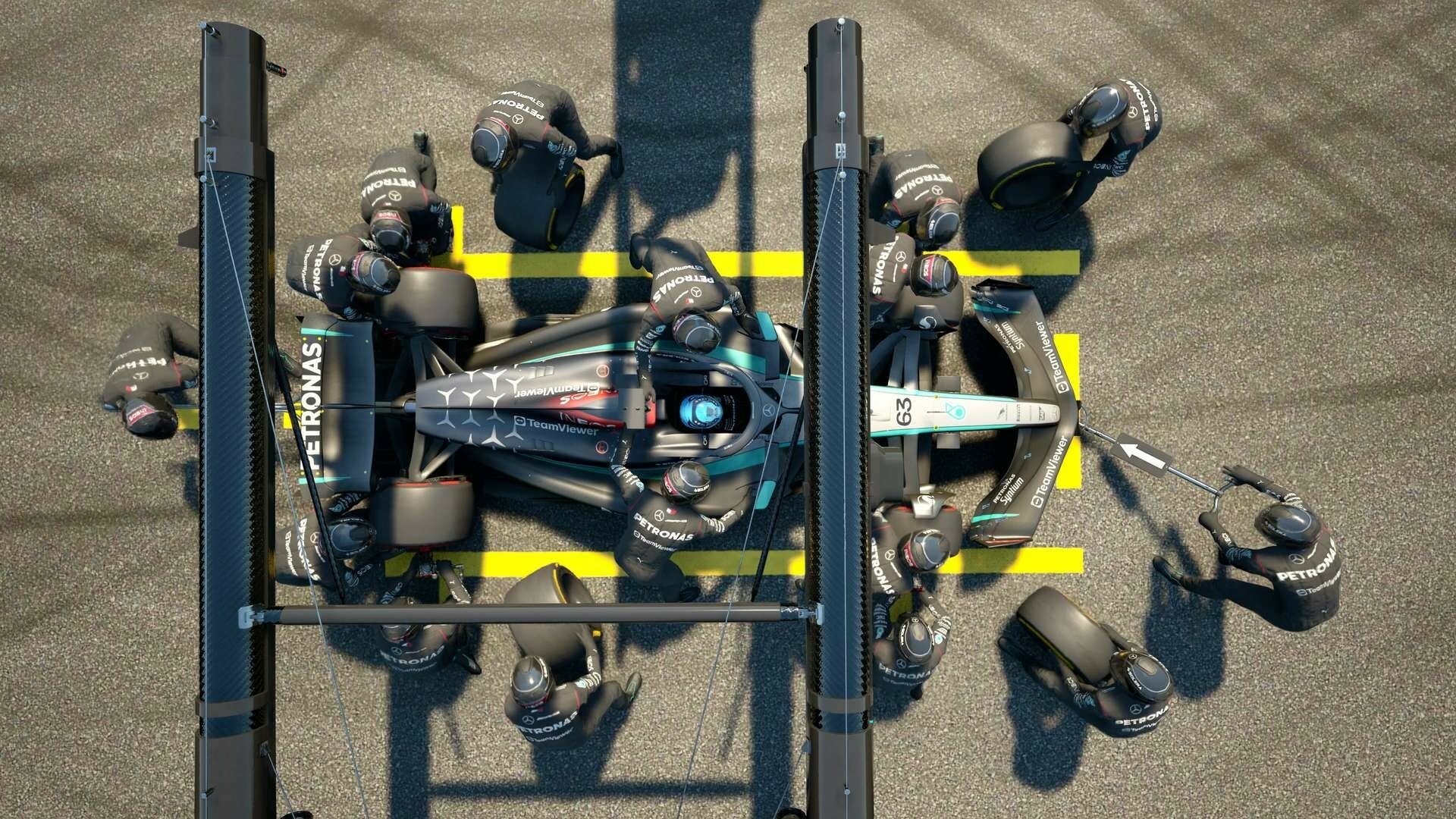 A top-down view of a Formula 1 car in a pit stop, surrounded by team members working efficiently, showcasing gameplay from F1 Manager 2024.