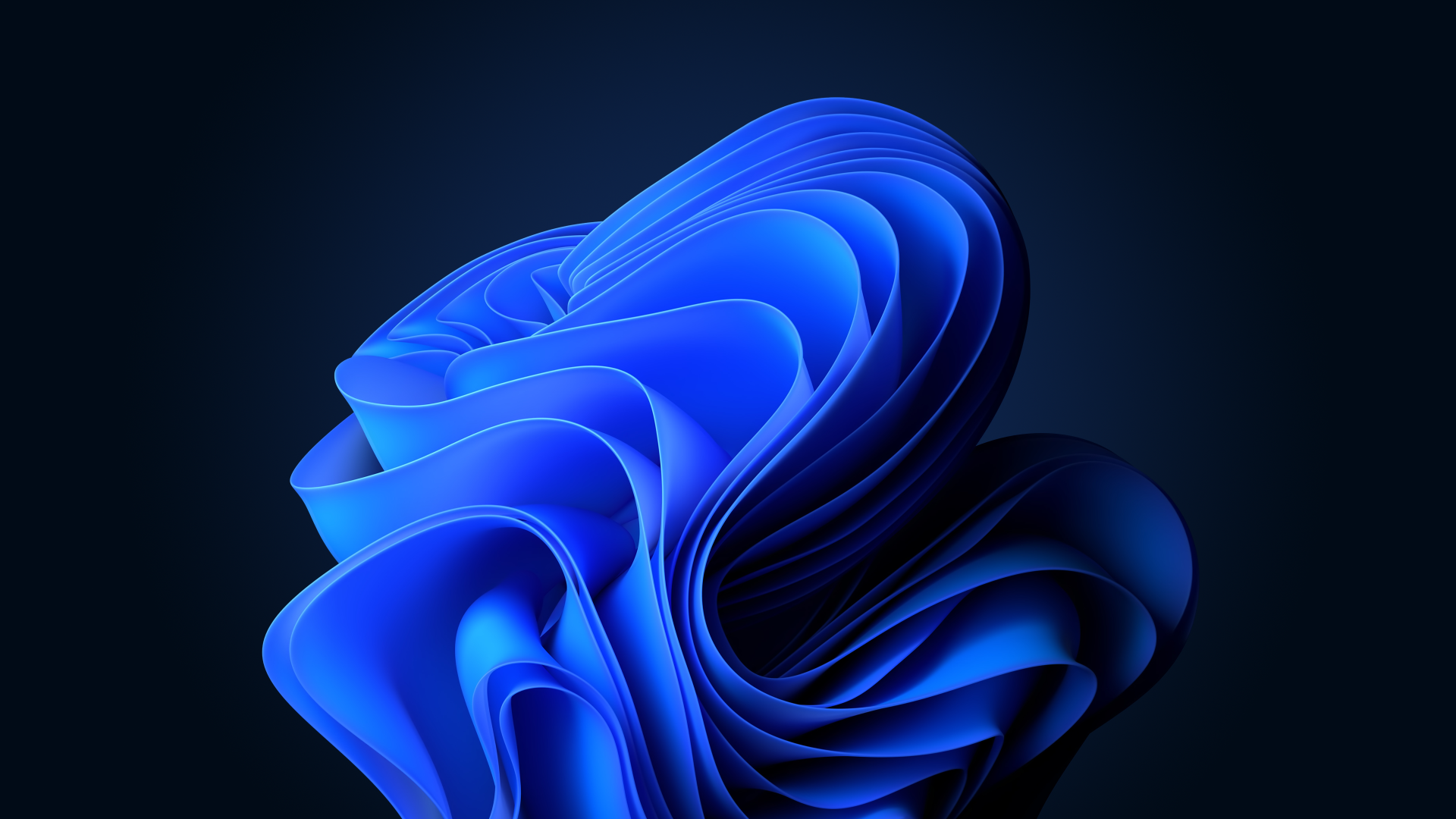 Abstract blue swirl design representing Windows 11 technology with a dark background.