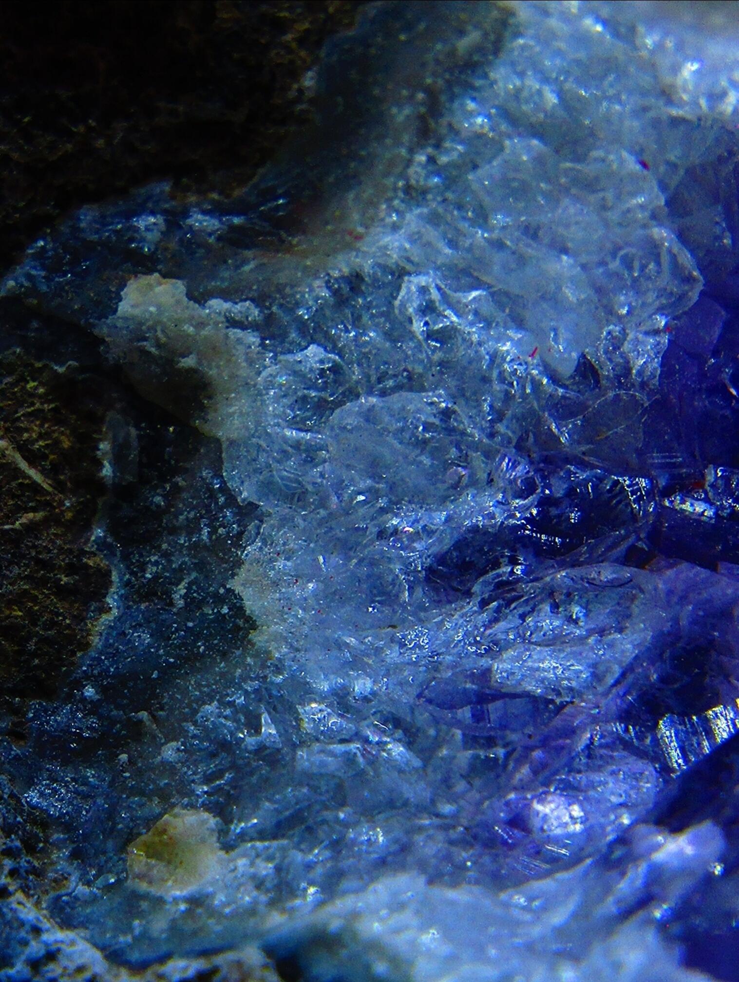Blue-purple amethyst rock crystal geode segment closeup by Demasc1