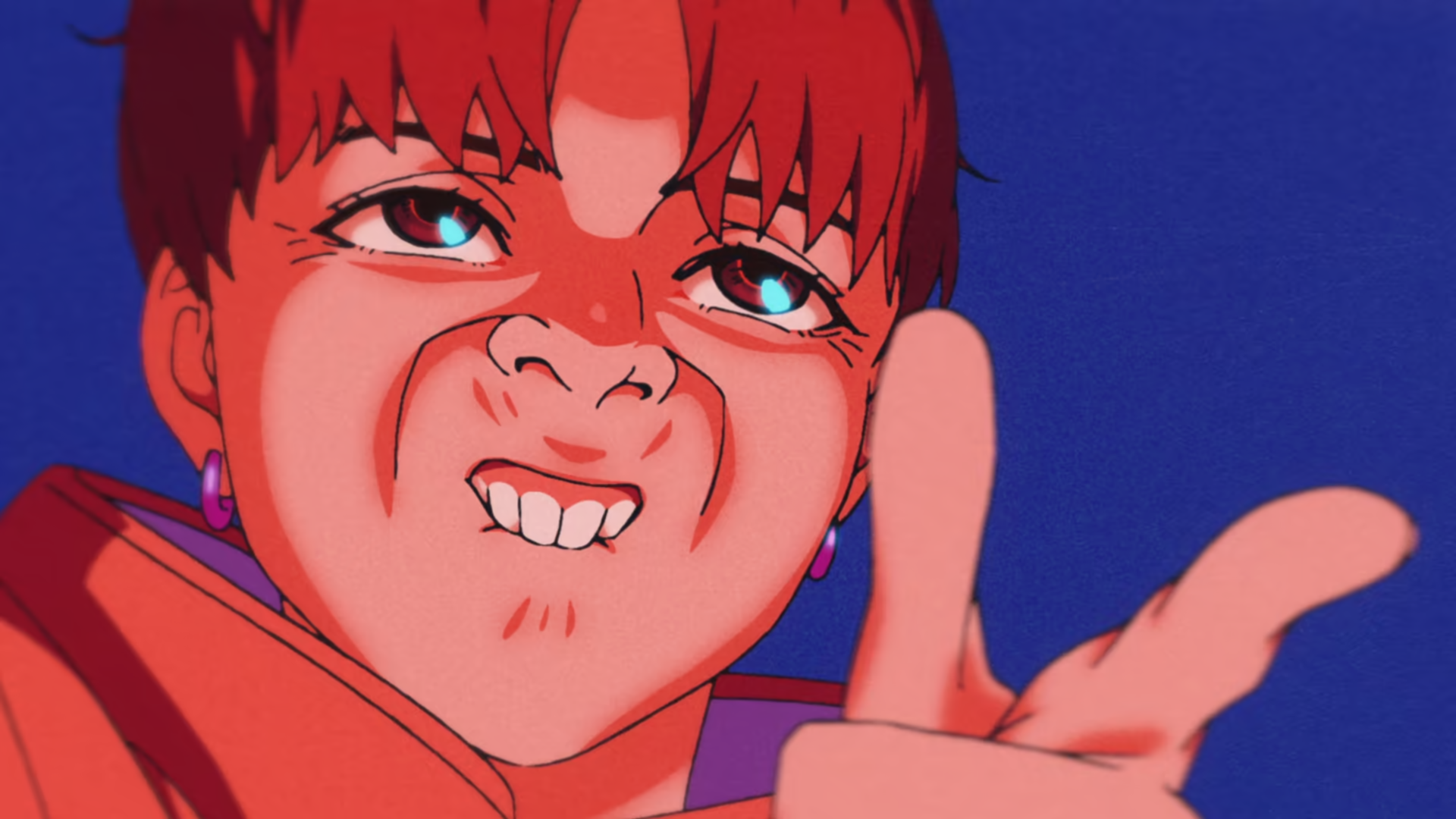 Close-up of a red-haired character from Dandadan making a playful finger-gun gesture with a confident expression against a deep blue background.