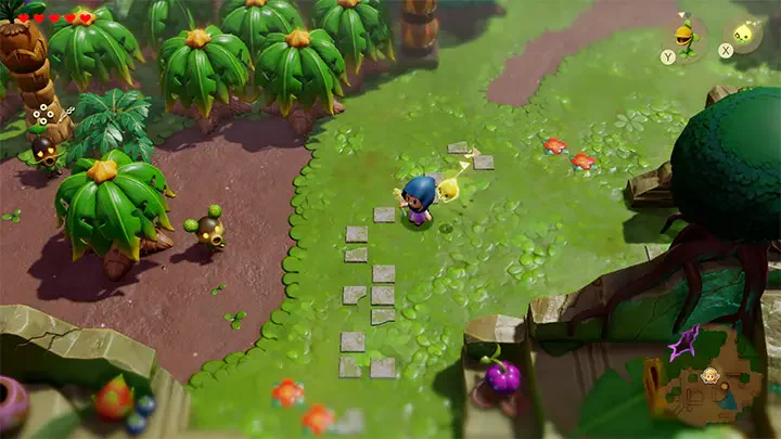 An overhead view from *The Legend of Zelda: Echoes of Wisdom*, showcasing a character navigating a vibrant landscape filled with palm trees and colorful elements.