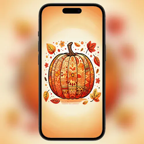 A smartphone displays an intricately designed pumpkin surrounded by autumn leaves and floral patterns, set against a warm, gradient background.