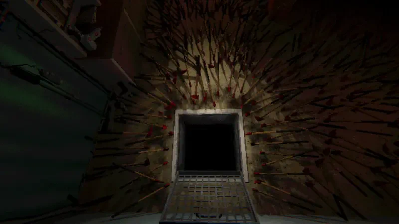 A dark room in a video game features a large, ominous opening surrounded by numerous sharp objects protruding from the walls, creating a tense atmosphere.