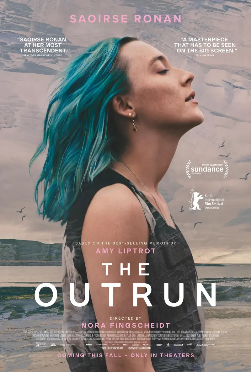 A film poster for The Outrun, featuring Saoirse Ronan with vibrant blue hair. The tagline highlights the film as a must-see masterpiece, directed by Nora Fingscheidt.