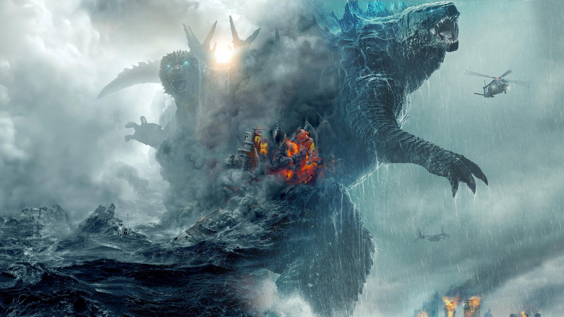 Godzilla from the 2023 and 2017 films stands towering in a stormy sea scene with rescuers and a helicopter nearby.