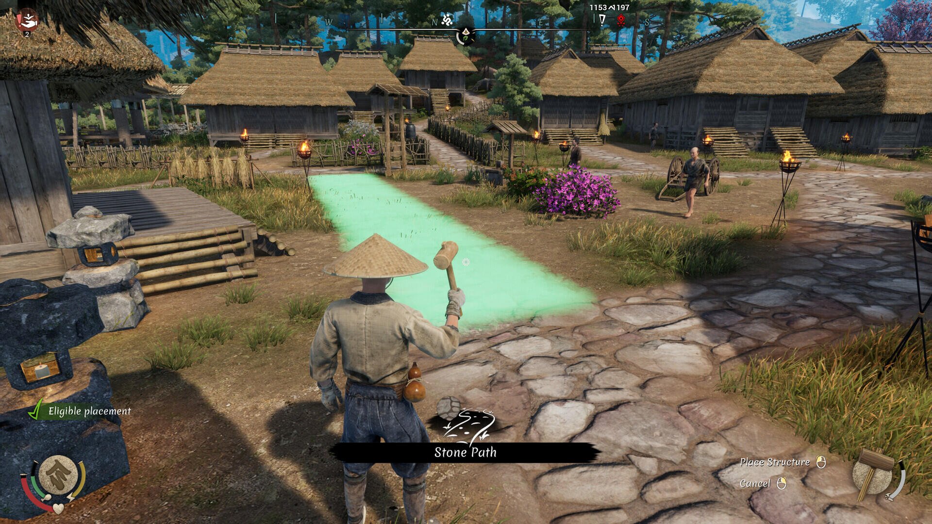 A character in traditional attire stands in a village setting in Sengoku Dynasty, with houses and greenery in the background, preparing to craft or interact with the environment.