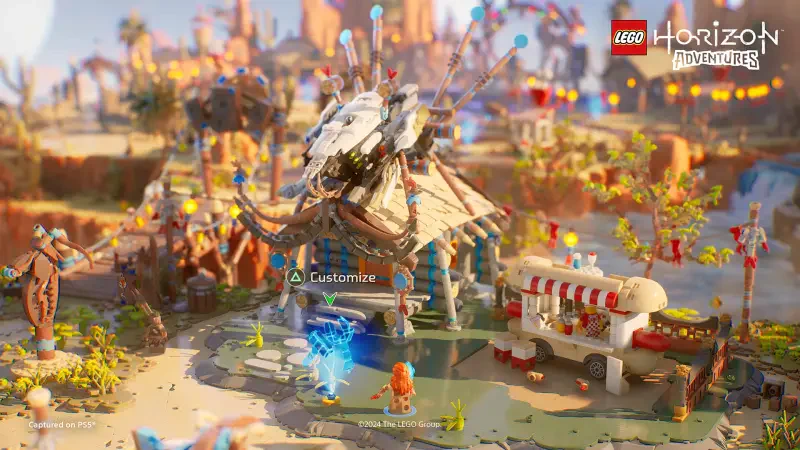A vibrant scene from the video game Lego Horizon Adventures, featuring a colorful landscape with whimsical buildings and playful elements, inviting exploration and creativity.