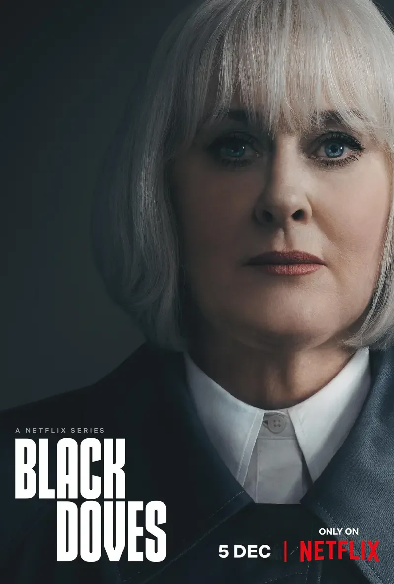 A close-up of a woman with silver hair, portraying a character in the Netflix series Black Doves, set to premiere on December 5.