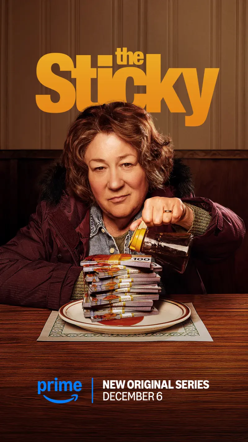 A woman pours syrup over a stack of pancakes in a promotional image for the TV show The Sticky, premiering December 6 on Prime Video.