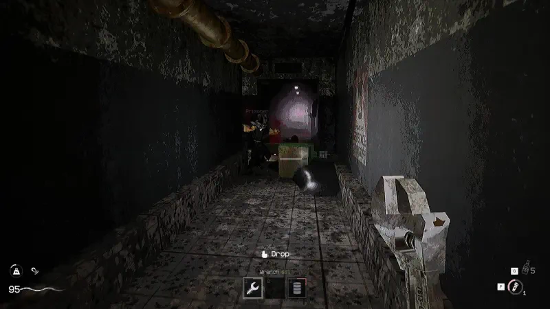 A dimly lit, eerie corridor from the video game KLETKA, featuring worn walls and scattered debris, evokes a sense of suspense and mystery. Various objects populate the scene, enhancing the atmosphere.
