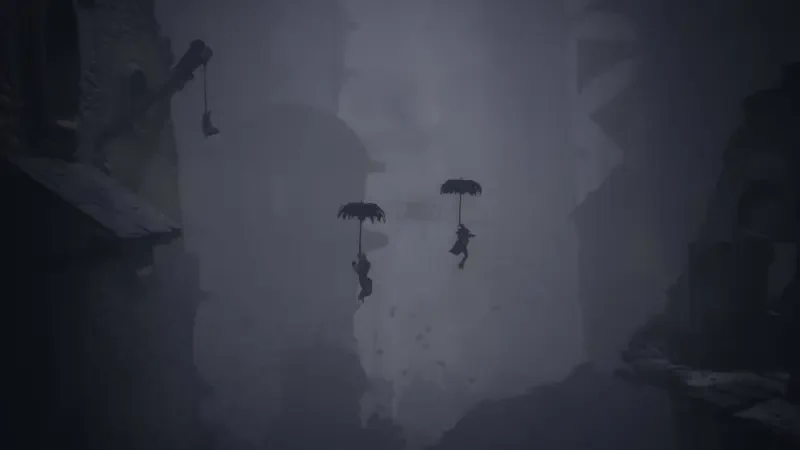 Two characters descend with umbrellas through a foggy, shadowy landscape in Little Nightmares III, creating a mysterious and eerie atmosphere.