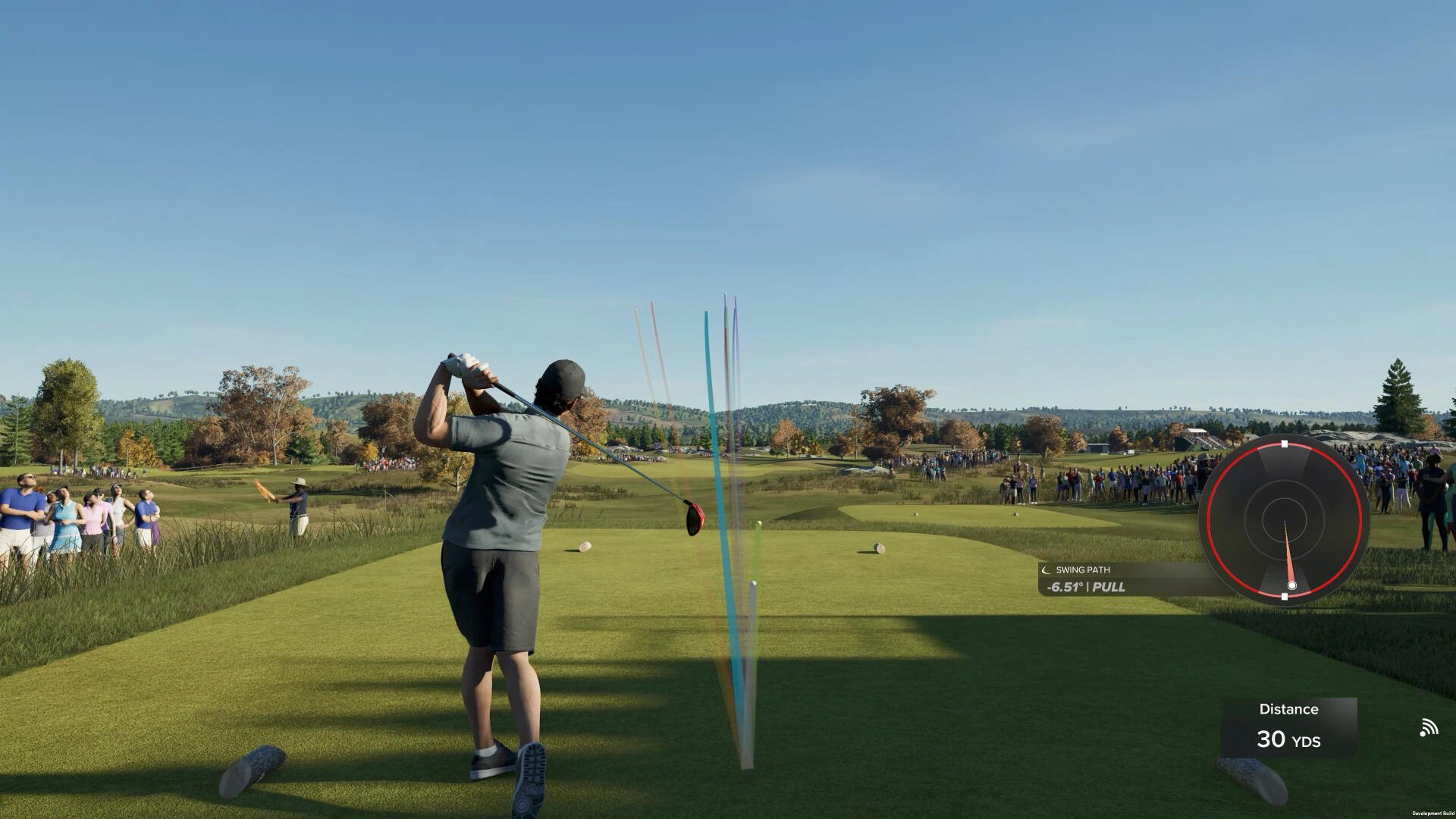 A golfer prepares to tee off in PGA TOUR 2K25, with a scenic landscape and audience in the background, showcasing dynamic gameplay and realistic graphics.
