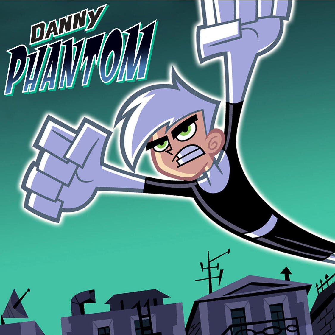 Danny Phantom lunges forward midflight over a silhouetted town, white hair and green eyes blazing against a teal sky with the Danny Phantom logo above.