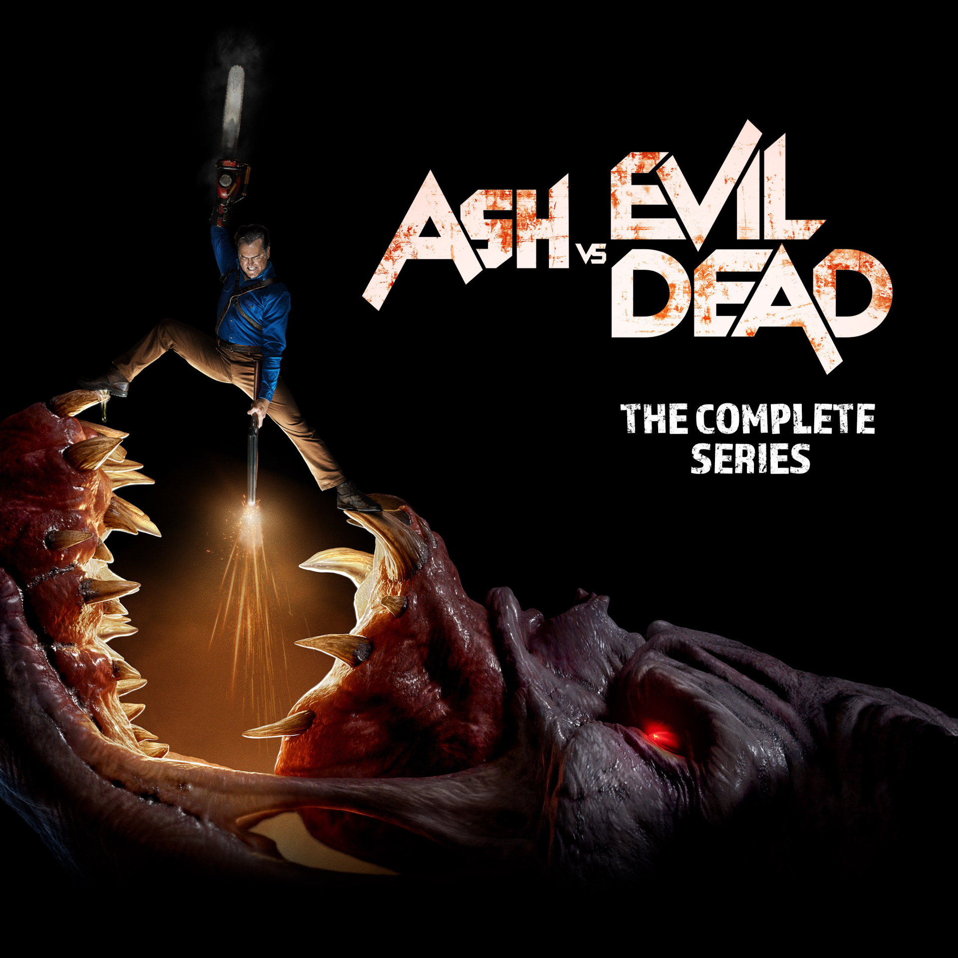 Ash vs. Evil Dead TV show poster: Ash dangles above a monstrous open mouth, chainsaw raised and flashlight beam lighting jagged teeth; series title visible.