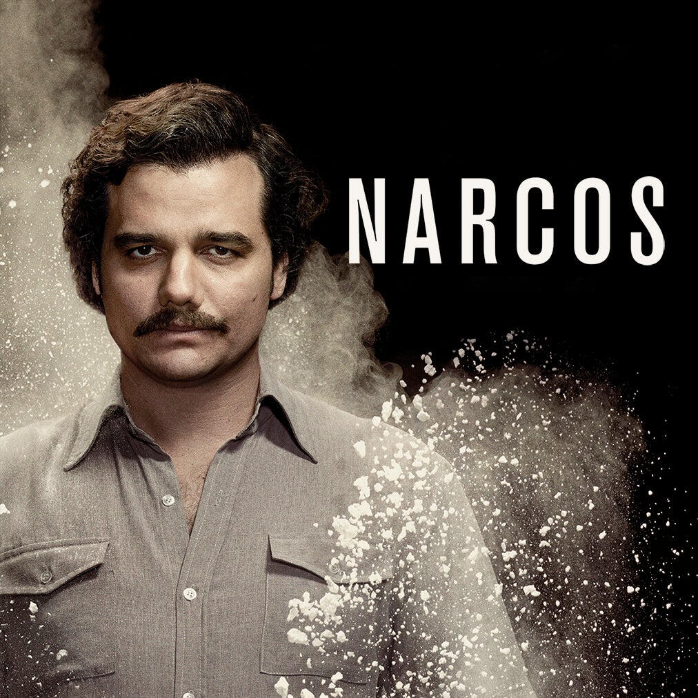 Promotional poster for the TV show Narcos: a stern man with a mustache in a buttoned shirt stands against a smoky dark background with the title NARCOS visible.