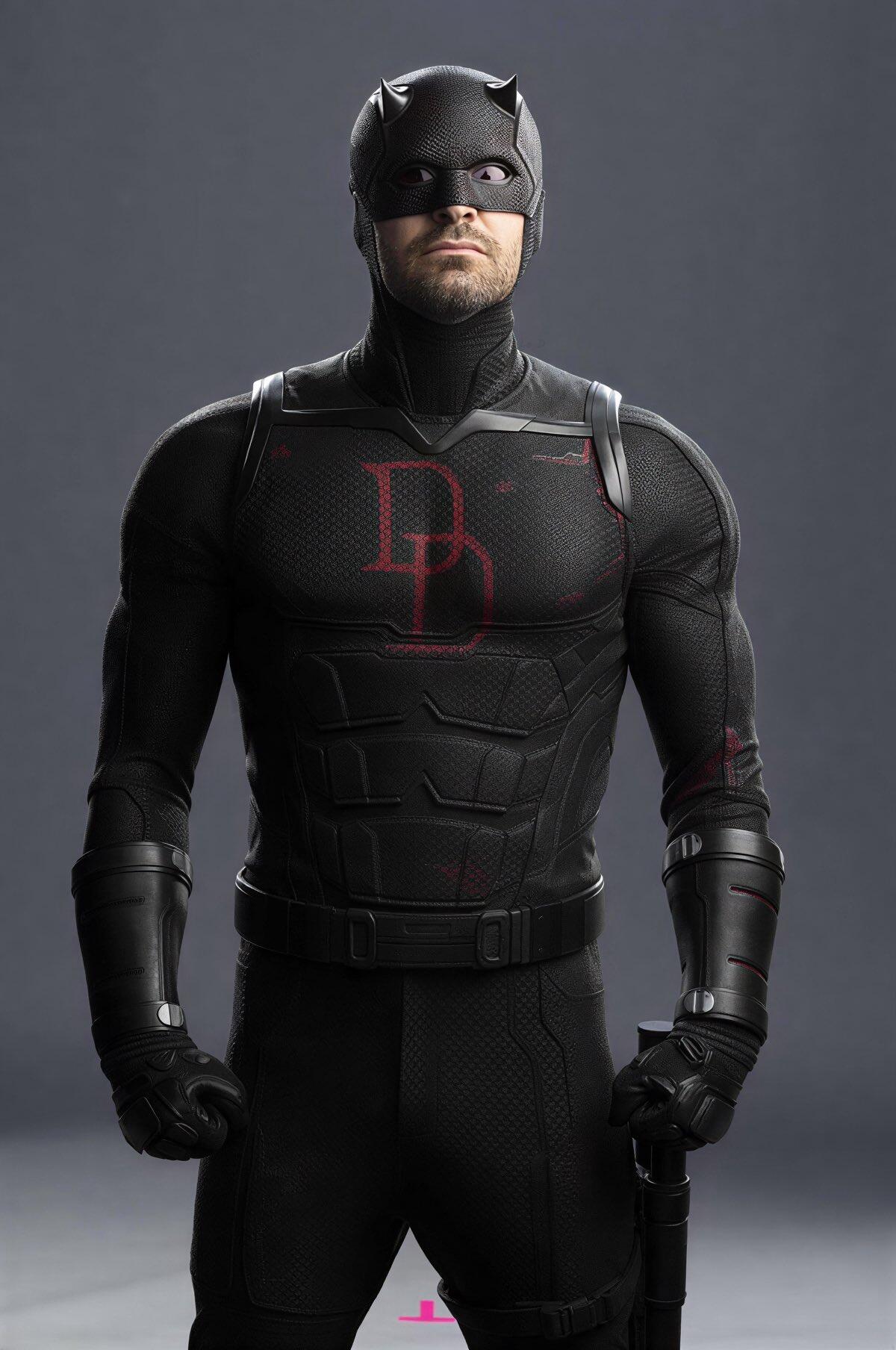 Armored masked vigilante in a black Daredevil suit with a red DD emblem and baton, posed against a gray backdrop — promotional image for the TV show Daredevil: Born Again.