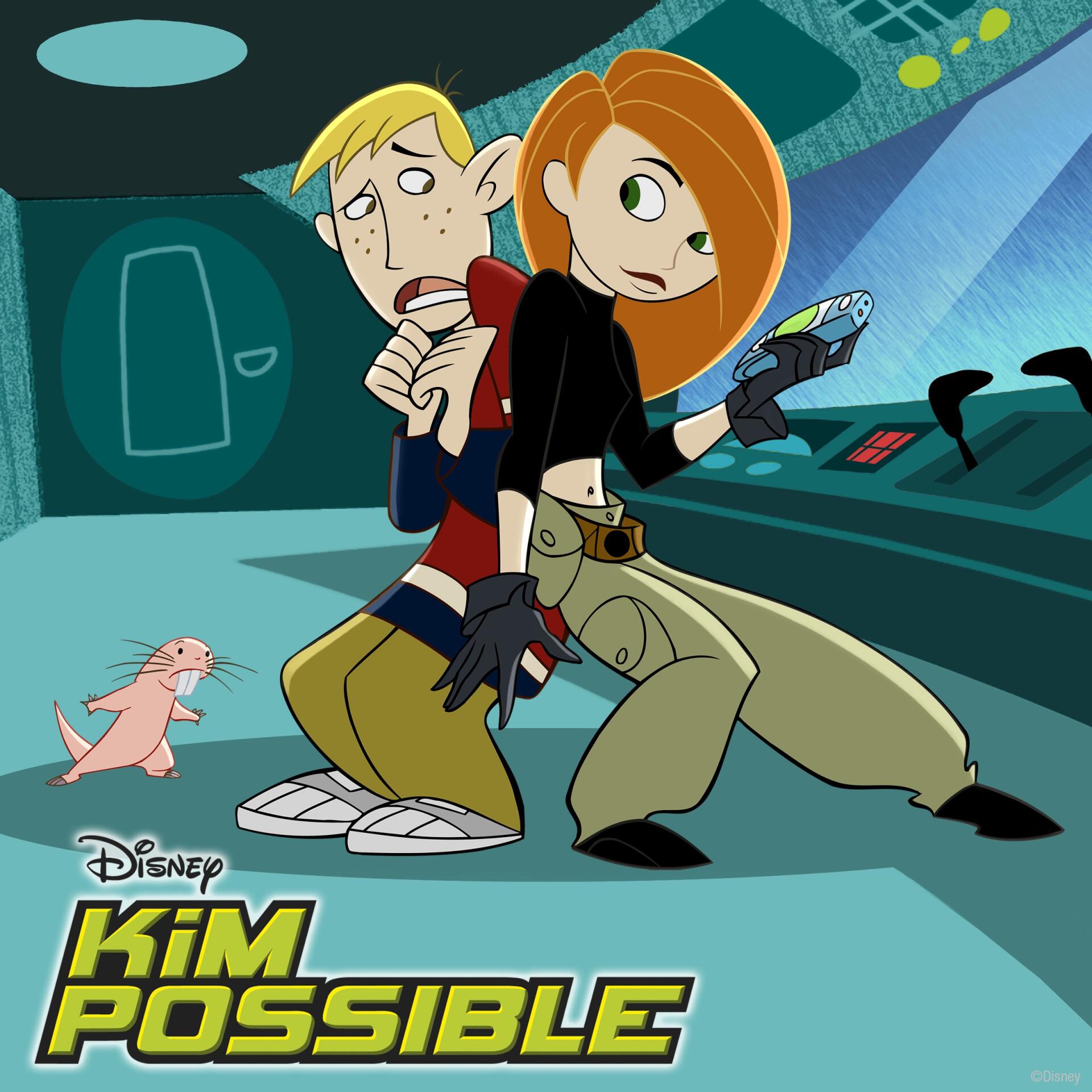 Kim Possible (TV show): Kim crouches with a communicator, Ron stands nervously behind her and Rufus the naked mole-rat scurries in a hi‑tech control room.