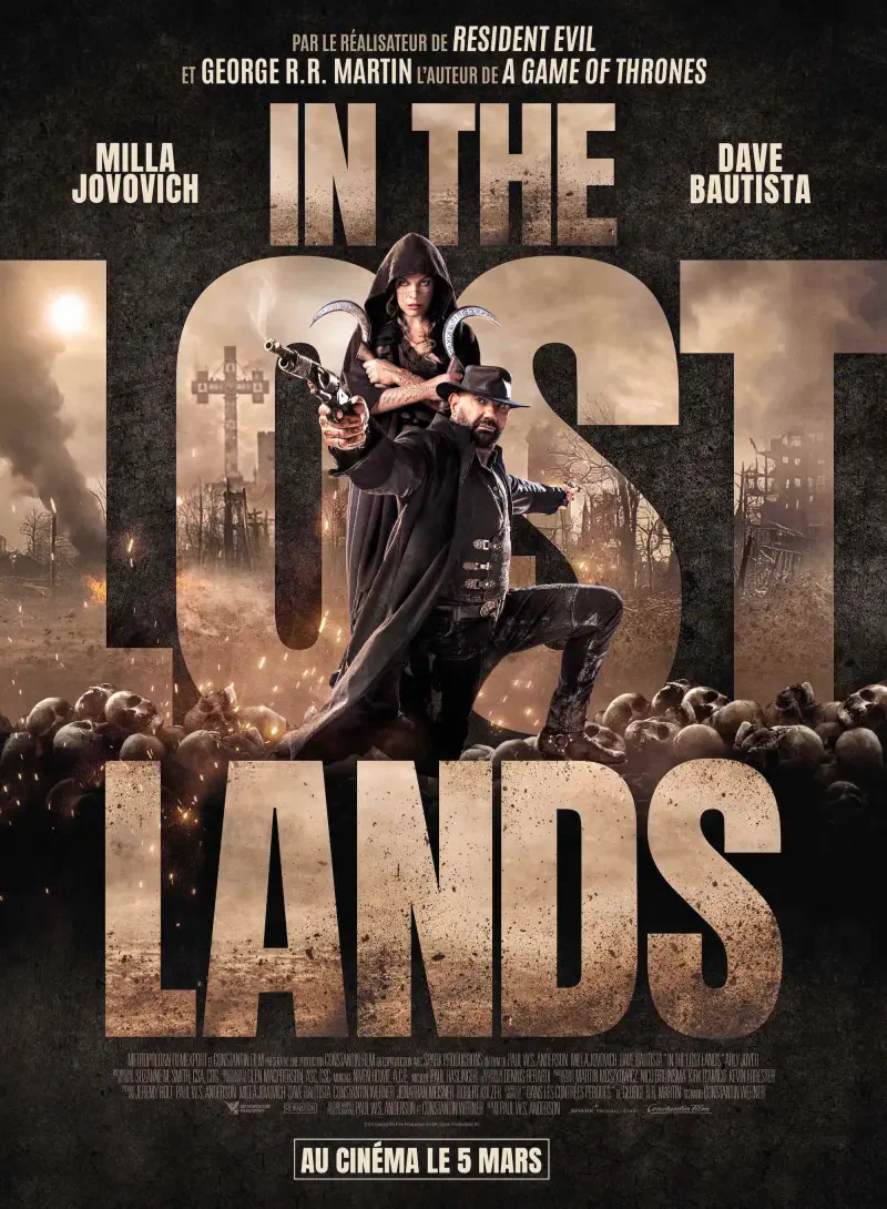 Movie poster for In The Lost Lands featuring Milla Jovovich and Dave Bautista, showcasing a dark and mysterious atmosphere with graveyard elements.
