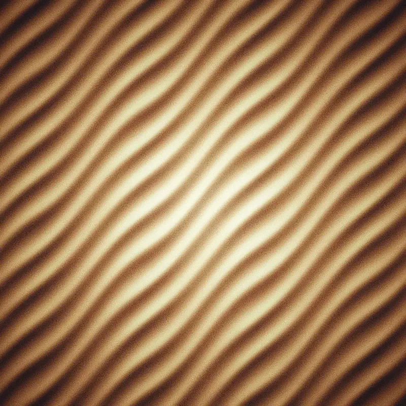 Golden sand dunes form a flowing raster pattern, capturing the natural texture of a desert landscape.