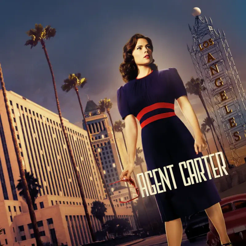 Agent Carter TV show poster: 1940s–dressed woman stands confidently before a stylized Los Angeles skyline, palm trees and a vintage theater marquee.