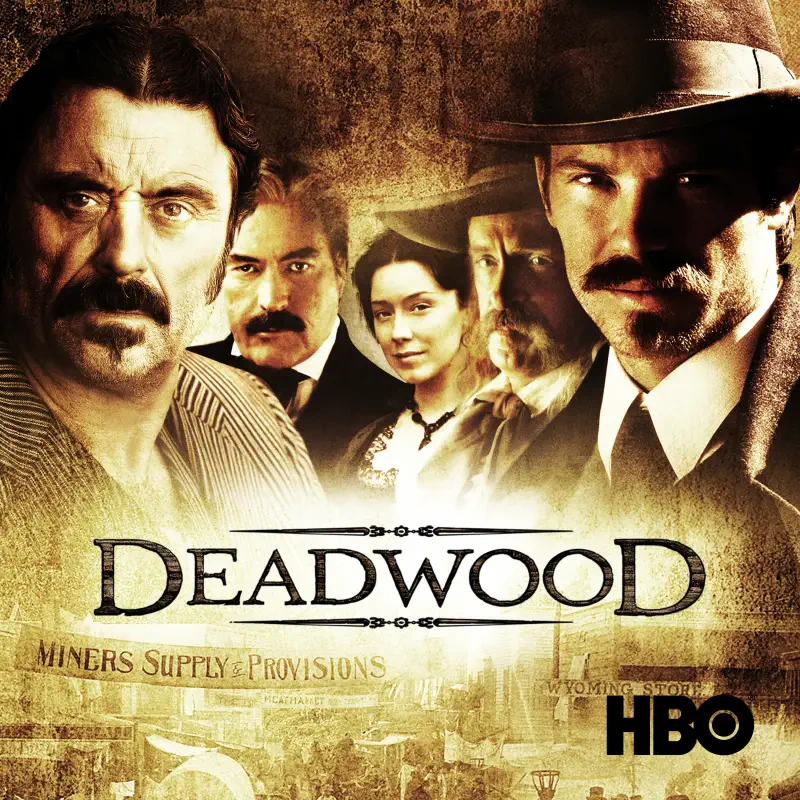 Sepia promotional poster for the TV show Deadwood showing five stern, mustachioed 19th-century figures in hats over a dusty frontier town; Deadwood title and HBO logo.
