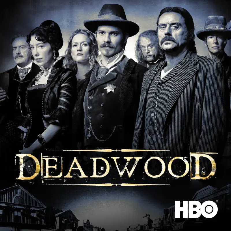 Poster for the TV show Deadwood: an ensemble of stern 19th-century Western characters in period dress beneath the Deadwood title and HBO logo.