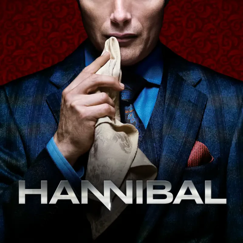 Promotional poster for the TV show Hannibal: a sharp-suited man holds a napkin to his mouth against a dark red patterned background.