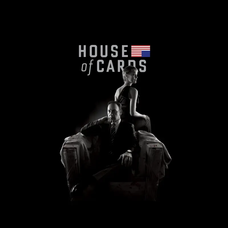 House of Cards TV show poster: a suited man sits in a shadowed armchair while a woman stands behind him, monochrome with a small US flag near the title.
