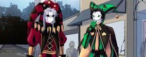 Two harlequin/pierrot jesters in red‑black and green‑black outfits, pale faces and unsettling yandere smiles, standing outside a sign for The Freak Circus.