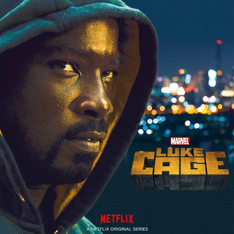 Promotional Luke Cage TV show image — close-up of a hooded, intense man with a blurred city skyline at night.