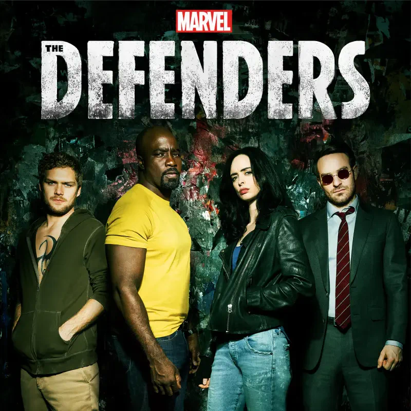 Promotional image for the TV show The Defenders: four vigilantes stand against a dark, graffiti-streaked wall beneath the series logo.