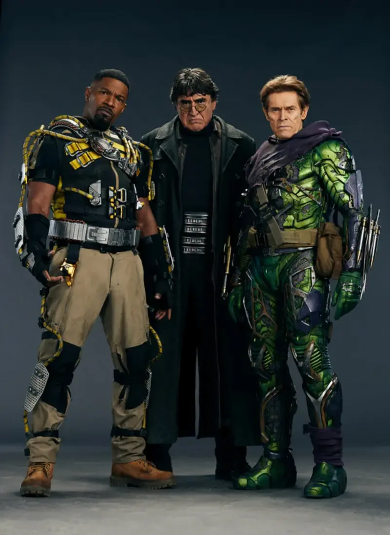 Three costumed villains from Spider-Man: No Way Home stand side by side: a central dark-coated figure flanked by a tactical-suited fighter and a green armored adversary.