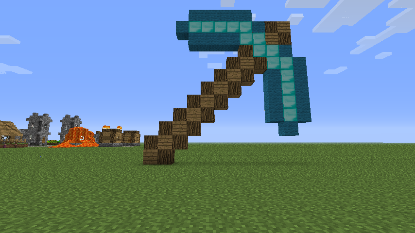 A large, pixelated diamond pickaxe crafted from blocks stands prominently in a Minecraft landscape, with structures and a lava flow in the background under a blue sky.